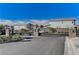 Stone pillars and iron fencing adorn the automated entrance to this upscale neighborhood and its luxurious homes at 2796 Sipe Springs St, Las Vegas, NV 89142