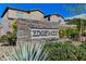 Stone sign reading Edgewood is surrounded by desert landscaping and hints at the beautiful homes inside at 2796 Sipe Springs St, Las Vegas, NV 89142