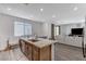 Open kitchen area features stainless appliances, granite counters, and a view of the living area at 2796 Sipe Springs St, Las Vegas, NV 89142