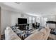 Living room with sectional, dinning table and exercise equipment at 2796 Sipe Springs St, Las Vegas, NV 89142