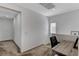 Carpeted loft with a small desk and chair setup, perfect for a compact workspace at 2796 Sipe Springs St, Las Vegas, NV 89142