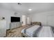 The primary bedroom offers a large bed, dressers, and comfortable seating area at 2796 Sipe Springs St, Las Vegas, NV 89142