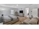 The primary bedroom has a well-lit with a large bed, dressers and couch at 2796 Sipe Springs St, Las Vegas, NV 89142