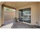 Covered patio with outdoor seating area and sliding door into home at 2796 Sipe Springs St, Las Vegas, NV 89142