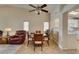 Open-concept dining space connected to living area and kitchen with tile flooring at 2805 Rungsted St, Las Vegas, NV 89142