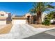 Charming single-story home featuring desert landscaping, solar panels, and a two-car garage at 2805 Rungsted St, Las Vegas, NV 89142