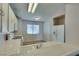 Efficient kitchen layout with white cabinets, white appliances and tile countertops at 2805 Rungsted St, Las Vegas, NV 89142