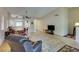 Open-concept living space boasts tile flooring, dining area, and neutral color palette at 2805 Rungsted St, Las Vegas, NV 89142
