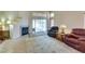 Bright living room featuring a fireplace, tile floors, and a sliding glass door to the backyard at 2805 Rungsted St, Las Vegas, NV 89142