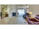 Inviting living room showcases tile floors, fireplace, and access to outdoor patio through glass slider at 2805 Rungsted St, Las Vegas, NV 89142