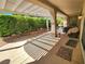 Extended patio with a pergola cover that is adjacent to a lush green space at 2809 Winslow Springs Dr, Henderson, NV 89052