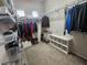 Walk-in closet with ample shelving and hanging space for organized storage, complete with carpet flooring at 2809 Winslow Springs Dr, Henderson, NV 89052