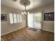 Dining area with bright lighting, tile flooring, and sliding glass doors to the exterior patio at 2809 Winslow Springs Dr, Henderson, NV 89052