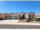 Charming single-story home featuring stucco walls, tile roof, desert landscaping, and a convenient three-car garage at 2809 Winslow Springs Dr, Henderson, NV 89052