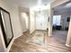 Inviting foyer with stylish tile flooring and a large mirror, leading to a bright, spacious interior at 2809 Winslow Springs Dr, Henderson, NV 89052