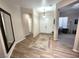 Open foyer with tile floors, neutral paint, decorative rug, and a view to the office at 2809 Winslow Springs Dr, Henderson, NV 89052