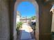 Inviting covered front porch area with elegant stone archway leading to outdoor seating at 2809 Winslow Springs Dr, Henderson, NV 89052