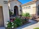 Lovely front entrance with blooming roses and a cozy seating area to welcome guests at 2809 Winslow Springs Dr, Henderson, NV 89052