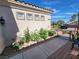 Charming single-story home with low-maintenance landscaping, blooming flowers, and desert features at 2809 Winslow Springs Dr, Henderson, NV 89052