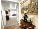 Hallway that leads into a comfortable carpeted living room space with plenty of natural light at 2809 Winslow Springs Dr, Henderson, NV 89052