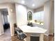 Well-lit kitchen bar area with modern stools and ample counter space, perfect for entertaining at 2809 Winslow Springs Dr, Henderson, NV 89052