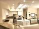 Well-lit kitchen with white cabinets, a center island, stainless steel appliances, and breakfast bar seating at 2809 Winslow Springs Dr, Henderson, NV 89052