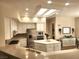 Bright, updated kitchen with white cabinets, stainless steel appliances, a center island, and tile backsplash at 2809 Winslow Springs Dr, Henderson, NV 89052