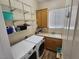 Laundry room with modern washer and dryer, shelving, sink and window at 2809 Winslow Springs Dr, Henderson, NV 89052