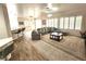 Spacious living room with a large gray sectional, shutters, and modern decor, creating a welcoming atmosphere at 2809 Winslow Springs Dr, Henderson, NV 89052