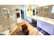 Luxurious main bathroom featuring dual sinks, a walk-in shower, and a separate soaking tub at 2809 Winslow Springs Dr, Henderson, NV 89052