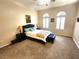 Comfortable main bedroom with plush carpeting, ceiling fan, and window shutters at 2809 Winslow Springs Dr, Henderson, NV 89052