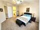 Comfortable bedroom boasts a ceiling fan and plush carpeting at 2809 Winslow Springs Dr, Henderson, NV 89052