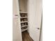 Well-organized pantry with white shelving provides ample storage space and organization for kitchen essentials at 2809 Winslow Springs Dr, Henderson, NV 89052
