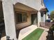 Charming covered patio with stone columns, and sliding glass doors overlooking a landscaped yard at 2809 Winslow Springs Dr, Henderson, NV 89052