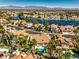 Picturesque view of waterfront homes with red tile roofs, sparkling pools, and palm-lined streets at 2909 Sterling Cove Dr, Las Vegas, NV 89128