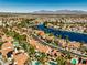 Stunning aerial view of a lakeside community with beautiful homes and mountain views at 2909 Sterling Cove Dr, Las Vegas, NV 89128