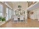 Elegant dining room with vaulted ceilings, a mirrored wall, and a stylish table setting at 2909 Sterling Cove Dr, Las Vegas, NV 89128