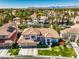 Charming home with red tile roof, mature landscaping, and a neatly manicured lawn, offering great curb appeal at 2909 Sterling Cove Dr, Las Vegas, NV 89128