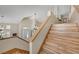 Bright foyer and stairway illuminated by natural light and featuring wood-look floors and neutral walls at 2909 Sterling Cove Dr, Las Vegas, NV 89128