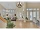 Bright, airy foyer featuring high ceilings, wood floors, and ample natural light from large windows at 2909 Sterling Cove Dr, Las Vegas, NV 89128