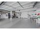 Spacious three car garage with epoxy floors, storage shelves, and lots of space at 2909 Sterling Cove Dr, Las Vegas, NV 89128