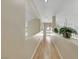 Upstairs hallway with a plant and a view of a window looking outside at 2909 Sterling Cove Dr, Las Vegas, NV 89128