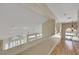 Upstairs hallway with multiple recessed lights overlooking downstairs at 2909 Sterling Cove Dr, Las Vegas, NV 89128