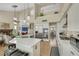 Open-concept kitchen and living area featuring stainless steel appliances, a gas range, and eat-in seating at 2909 Sterling Cove Dr, Las Vegas, NV 89128