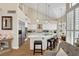 Bright kitchen with white cabinetry, stainless steel appliances, and a large center island with bar seating at 2909 Sterling Cove Dr, Las Vegas, NV 89128