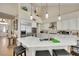 Spacious kitchen with white cabinets, stainless steel appliances, a large island, and barstool seating at 2909 Sterling Cove Dr, Las Vegas, NV 89128