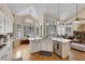Bright kitchen featuring white cabinets, granite countertops, an island, and stainless steel appliances at 2909 Sterling Cove Dr, Las Vegas, NV 89128