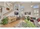 Cozy living room with vaulted ceilings, a piano, and abundant natural light at 2909 Sterling Cove Dr, Las Vegas, NV 89128