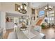 Well-lit living space with a dining table and a staircase that leads upstairs at 2909 Sterling Cove Dr, Las Vegas, NV 89128