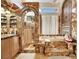 Custom bathroom with custom marble tilework, soaking tub, step in shower, and dual vanity at 2909 Sterling Cove Dr, Las Vegas, NV 89128